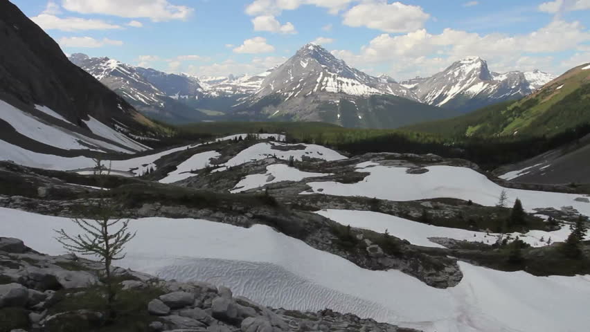 Scenic shot of spring snowfields and distant mountains