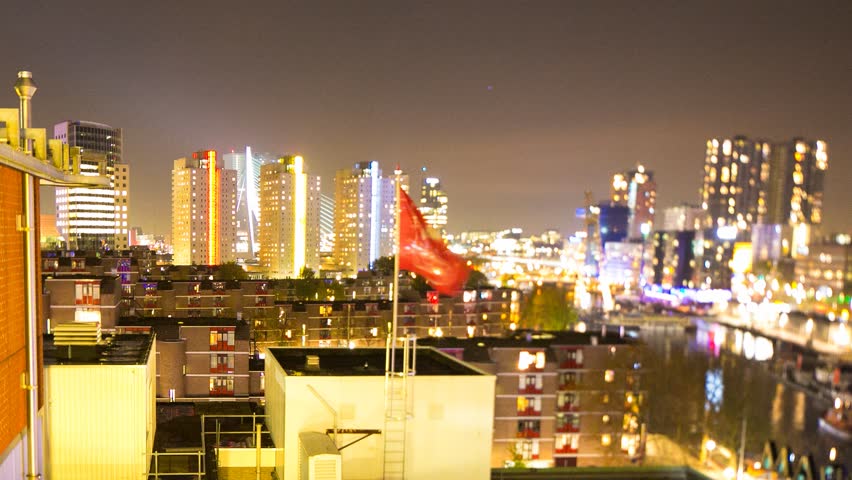 Static timelapse with the lights turned on in the urban skyline that makes up this european city, Rotterdam, the Netherlands, November 2014
