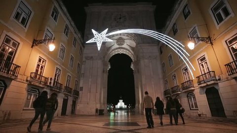 Cinemagraph Loop -People walking through old archway as tram passes at night - motion photo Vídeo Stock
