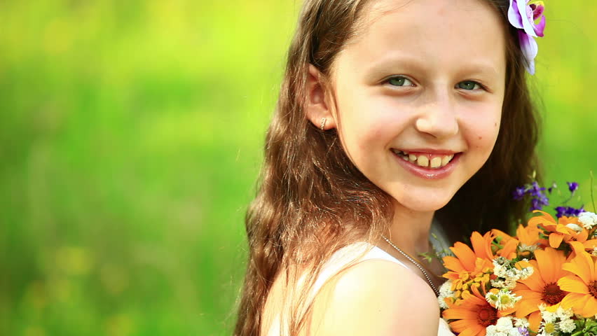 Close-up portrait of a girl with flowers 