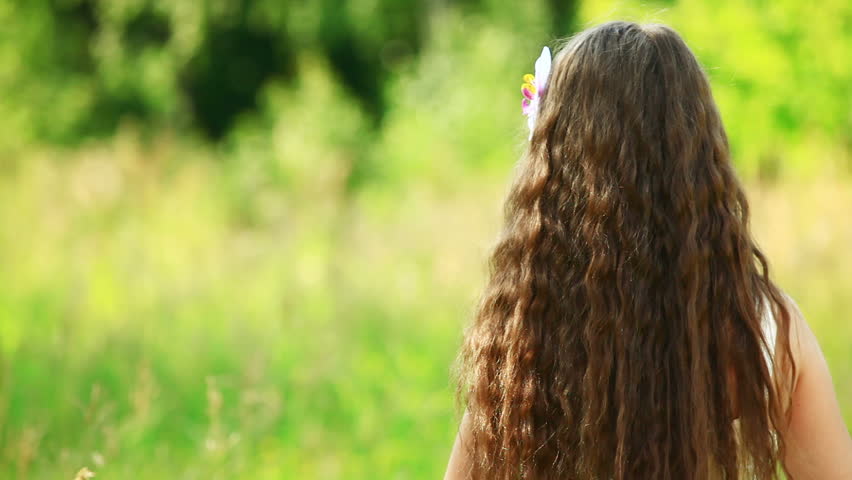Girl turning to the camera. Close-up. 