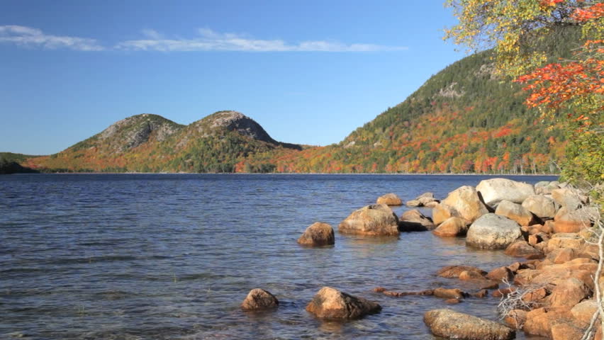 Locked down shot of North Bubble & South Bubble ("The Bubbles") and Jordan Pond on an autumn day.