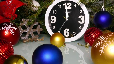 Clock and christmas balls and toys in a red bag, zoom in