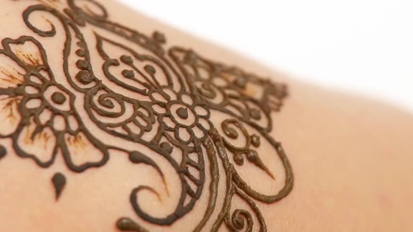 Woman`s hand decorated with henna tattoo, mehendi, on black background, close up, cam moves top down, slow motion | Shutterstock HD Video #12570149