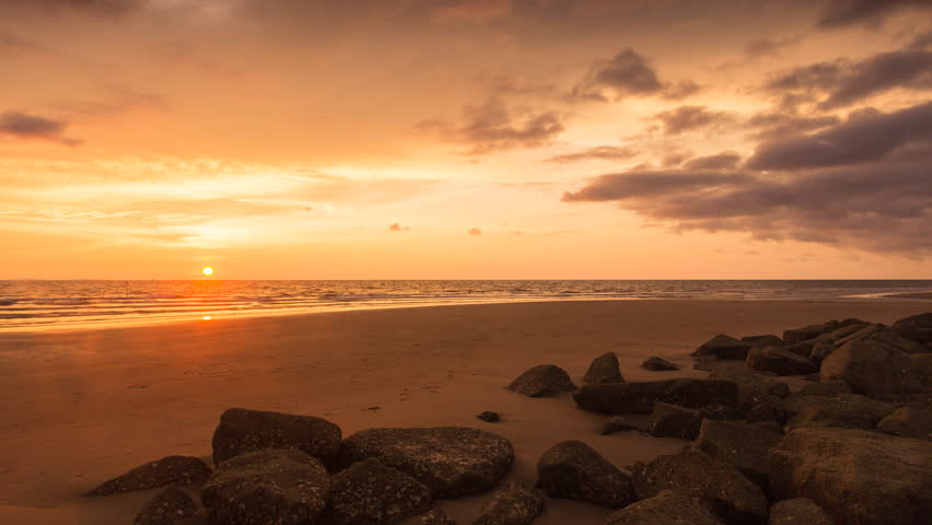 Time lapse of beautiful sunset sky over the beach