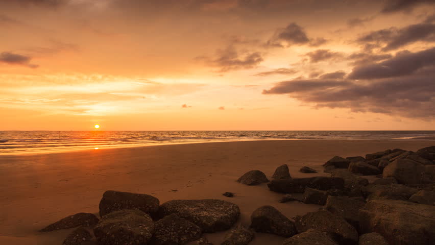 Time lapse of beautiful sunset sky over the beach