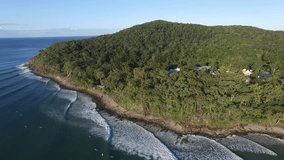 Aerial footage views of Queenslands Noosa Heads and Little Cove National Park , with clean blue pristine tropical water. Featuring surfing, surfers, wetlands, sandbars, tourists and holiday makers. 