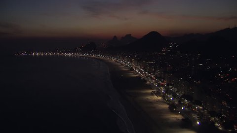 Flying above Copacabana Beach at Night in Rio de Janeiro, Brazil