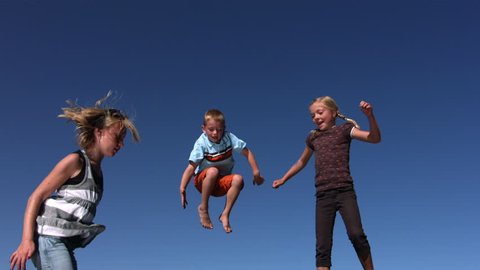 Cinemagraph - Kids jumping on trampoline. Motion Photo. Adlı Stok Video
