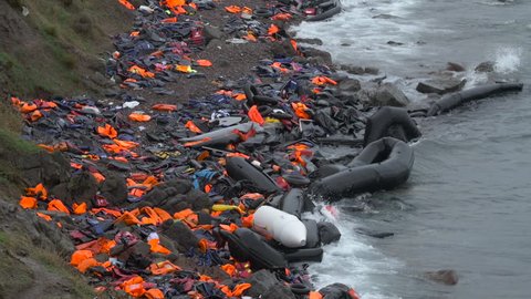 Destroyed rafts and abandoned life jackets line the beaches of Lesbos, Greece as thousands of refugees pour into Europe. 