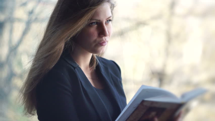 Girl reading a book | Shutterstock HD Video #12594881