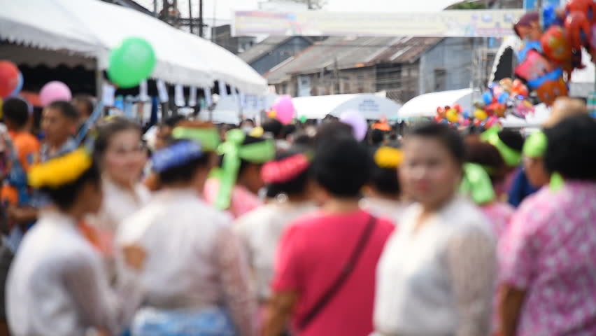 De-focused street crowd of people walk