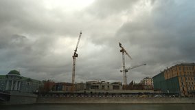 Cloudy weather Moscow river and construction site time lapse video