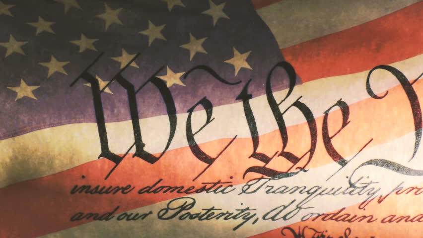 US Constitution of America with United States red white and blue flag waving in the background  Royalty-Free Stock Footage #12606101