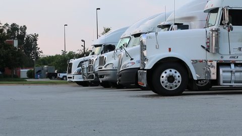Tractor/Trailers (18 Wheelers) Parked in a Row at a Truck Stop in the USA