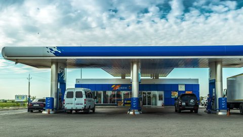 4K Timelapse.  Many Cars refuel at the gas station Gazpromneft. Kazakhstan - 20 August 2015