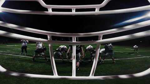 First person point of view from inside a football player's helmet, as the player makes a touchdown