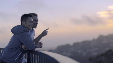 Profile Of Gay Couple Enjoying Sunset At Twin Peaks In San Francisco Stock Video