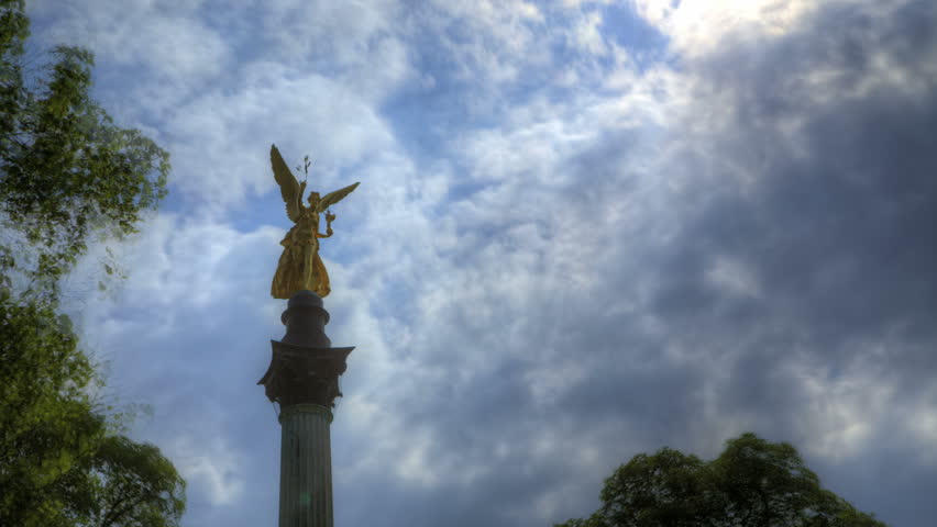 Angel of peace in front of blue sky