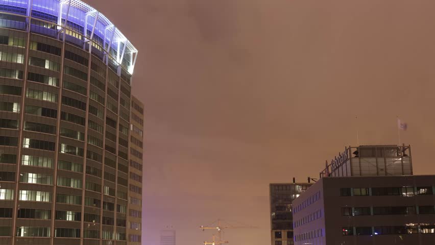 Time-lapse on a cloudy night between the skyscrapers in Rotterdam, the Netherlands, November 2014