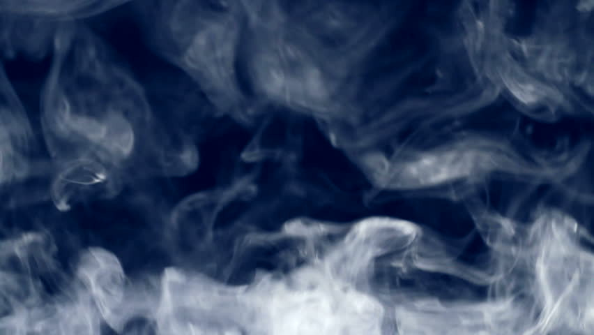 Smoke rising up against black background