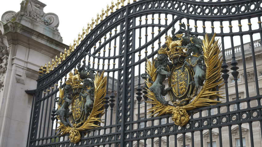 The front entrance of the Buckingham Palace. The shield is quartered, depicting in the first and fourth quarters the three passant guardant lions of England