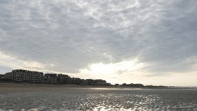 Sunset over Cabourg city on the Le Mans channel close-up 4K 2160p 30fps UltraHD footage - Sunlight over beach on northern France Normandy style buildings 4K 3840X2160 UHD video