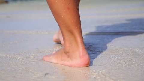 Woman Feet Walking in Sea - Beach Vacation. Slow Motion. HD, 1920x1080.  