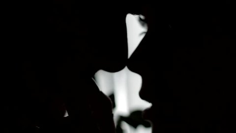 Erotic kiss. Passionate kiss on a background of window. Silhouette of two lovers. Passionate kiss.