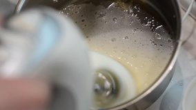 Video of electric mixer whipping cream 