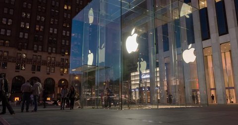 NEW YORK - MAY 14, 2015: Apple store entrance on 5th Avenue in Manhattan. As of 2014, Apple employs 72,800 permanent full-time employees, maintains 437 retail stores in fifteen countries. Time lapse. 