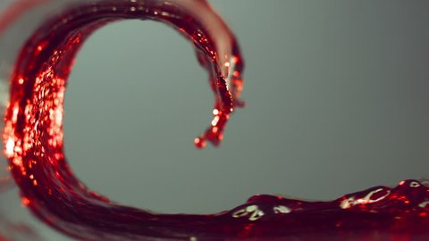 wave of red wine, grape juice, pomegranate juice, raspberry juice, cherry juice , slow motion, white background
