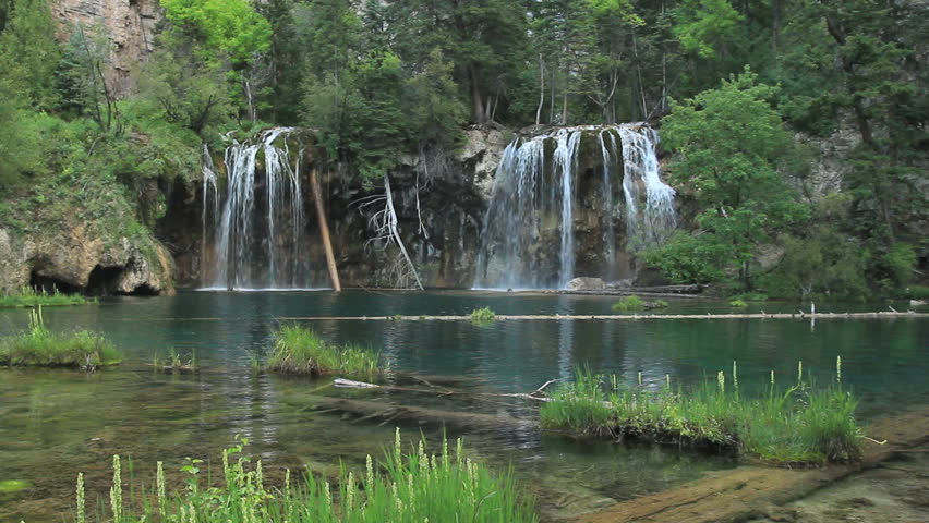 Beautiful waterfall in the Rocky Mountains in summer. HD 1080p.