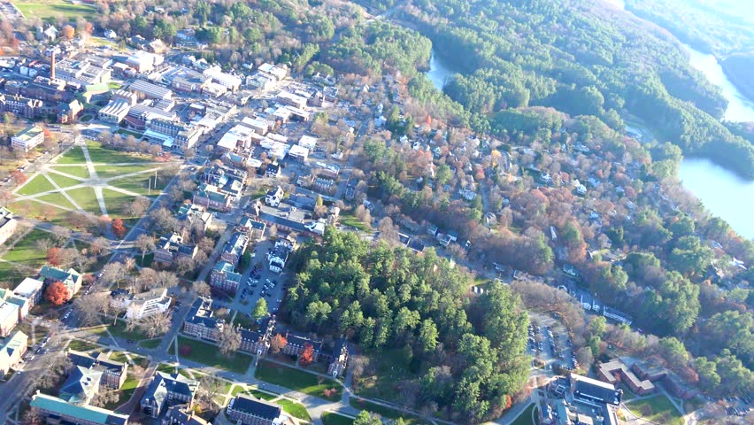 AERIAL Hanover, New Hampshire, close view, Dartmouth College area. Looking down over small  town near White Mountains.