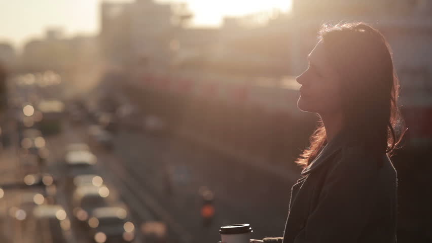  Beautiful girl drinking coffee on the street  | Shutterstock HD Video #12701033