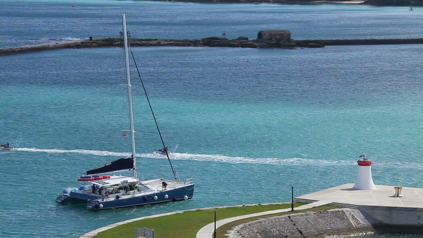 A sailboat heads into port at King's Wharf on the island of Bermuda.