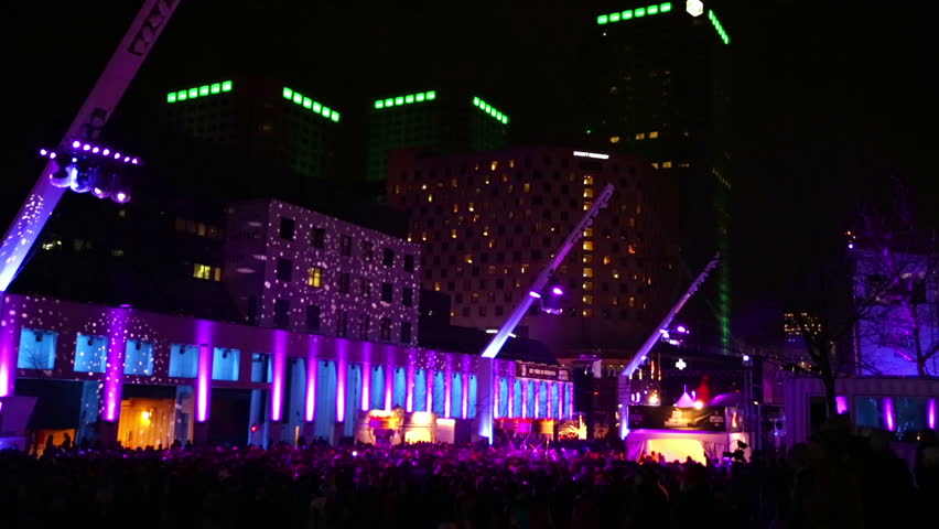 Crowds at the Montreal High Lights Festival en Lumière 2014 at night with the projected light patterns on the buildings.  | Shutterstock HD Video #12706946