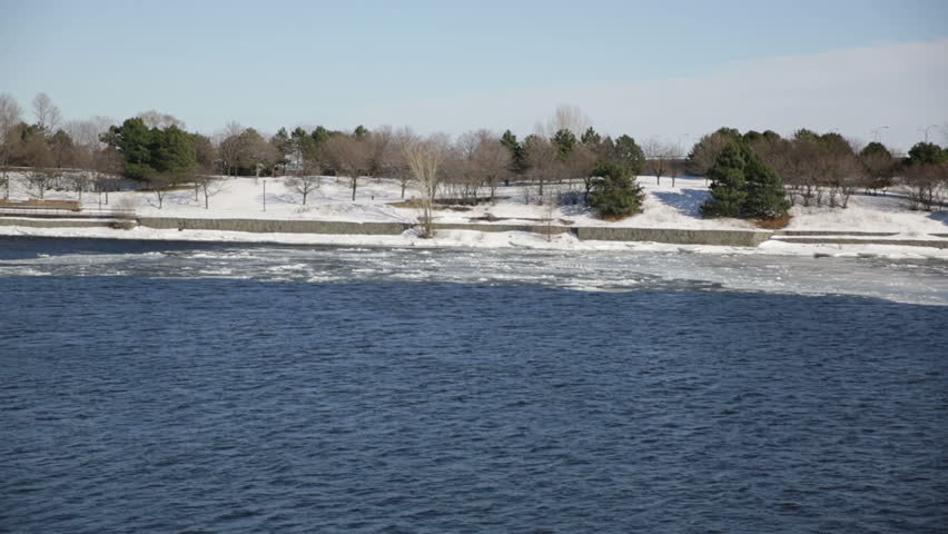 Banks of the St Lawrence river with frozen ice and snow on St Helen
