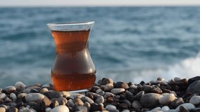 Turkish tea close up clip on Mediterranean sea coast.