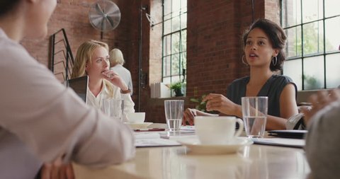 Multi-ethnic business team meeting involved diverse people participating in creative sustainable ideas steadicam shot across boardroom table shared work space