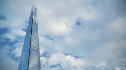 Shard Building Peak in Blue Sky Reflecting Clouds moving across 4K UltraHD Timelapse