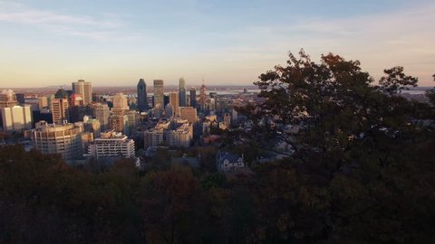 4K aerial drone shot of montreal skyline at sunset forward move