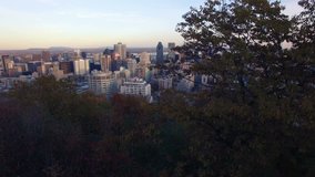 4K aerial drone shot of montreal skyline at sunet up move