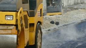 Road roller doing road repair and paving of streets, Building a New Road with Road Repair In Slow Motion, Slow Motion Video clip
