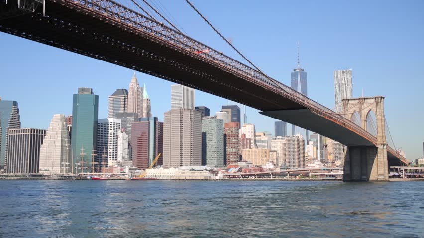 Skyscrapers, Brooklyn Bridge and East river in New York city | Shutterstock HD Video #12742148