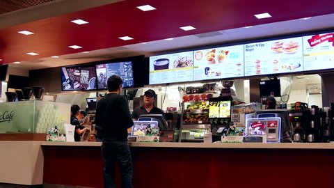 Coquitlam, BC, Canada - November 10, 2015 : People ordering food at mcdonalds check out counter in Coquitlam BC Canada with 4k resolution