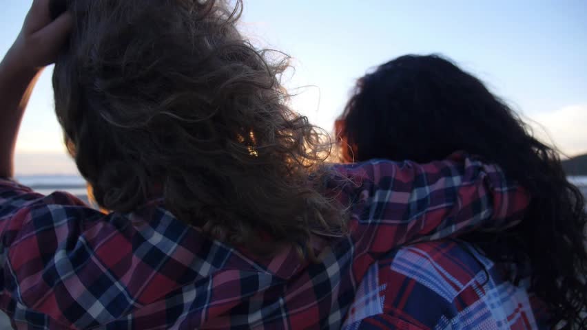 Young Women at Sunset Beach. Slow Motion. HD, 1920x1080.