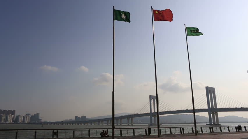 Macau cityscape of bridge and China national flag and the Macau Flag,macau china,October 2015, Many casino hotels in Macau,It is the operating income of the world