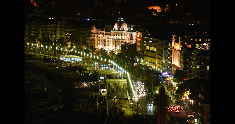 FRANCE, NICE, 15.09.2015: Top view on the Promenade de Anglais at night, hotel Negresco, illumination, traffic, tourists 