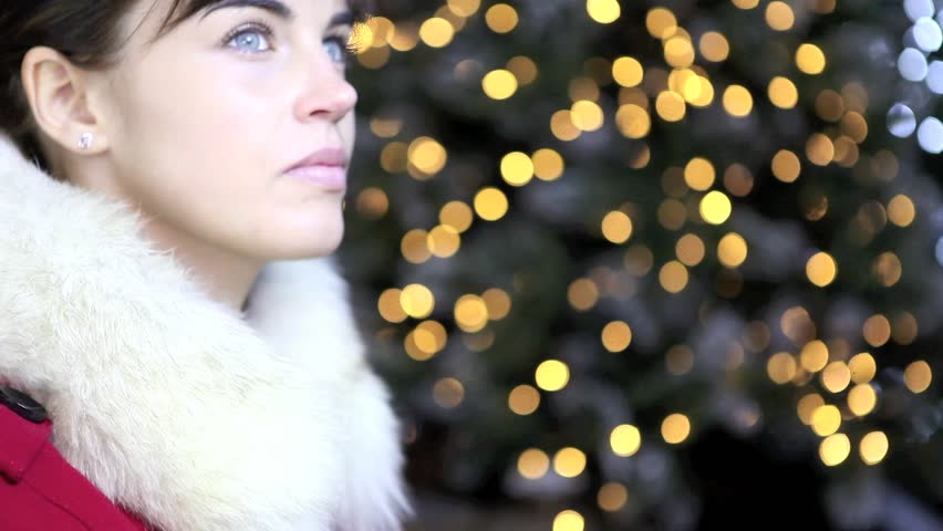 Christmas woman with decoration golden house on lights background